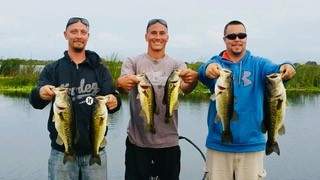 Fishing party displaying their catch