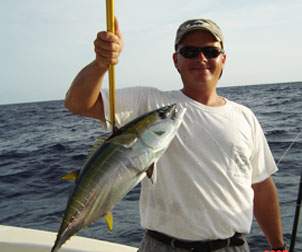 Man holding a Yellowfin Tuna up